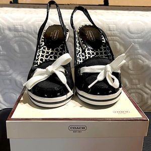 Never worn COACH HEELS.